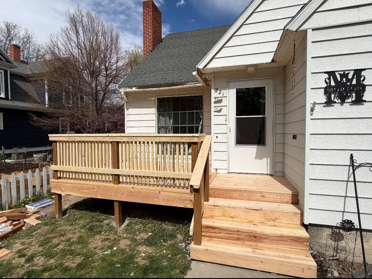 New wood deck with railing and steps